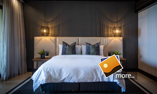 Bath, bedroom and balcony of luxury Garden room at Zimbali Resort