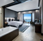 bed, bath and balcony in Luxury room